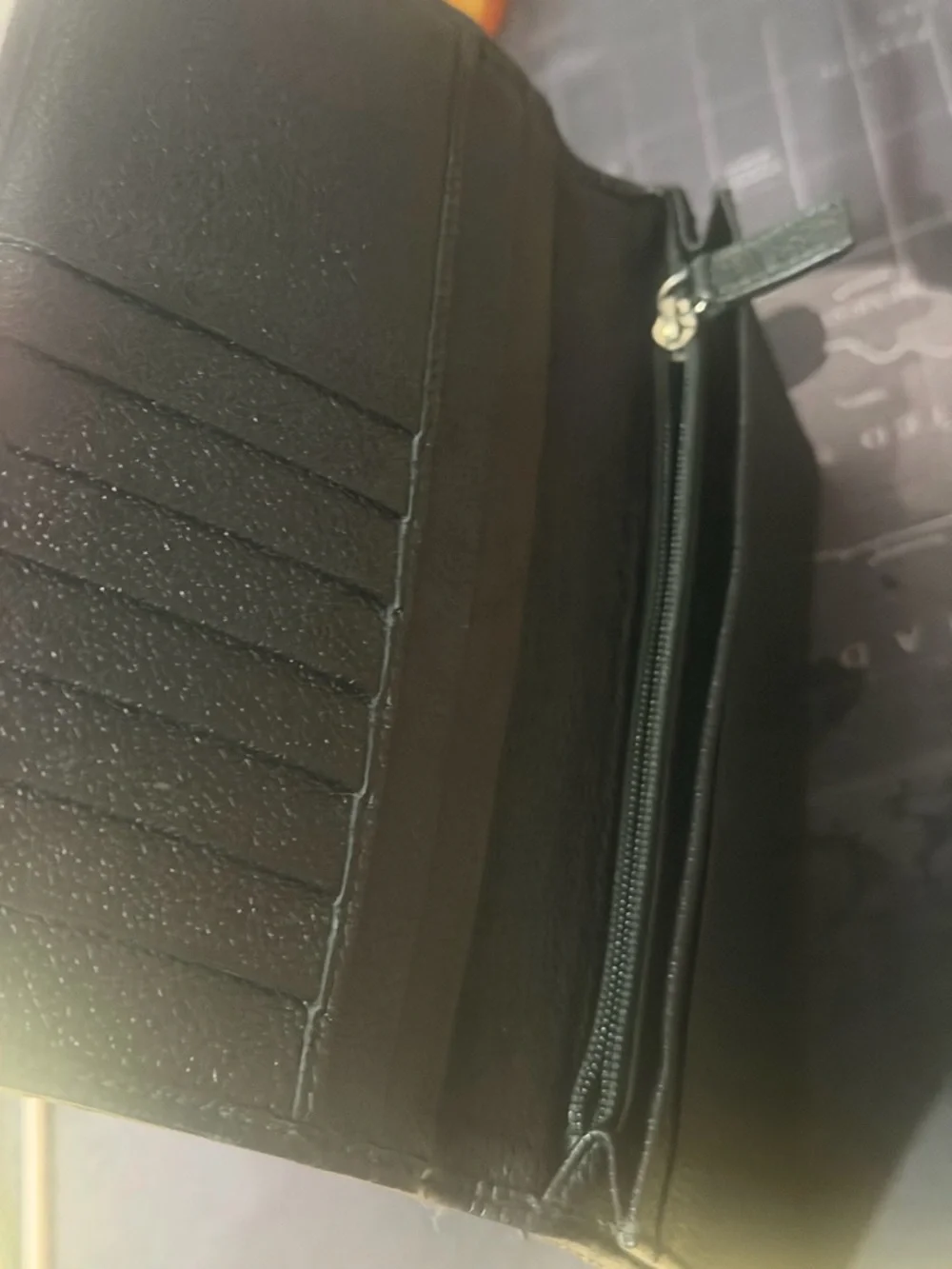 BVLGARI Mille Righe long wallet made from PVC and leather.